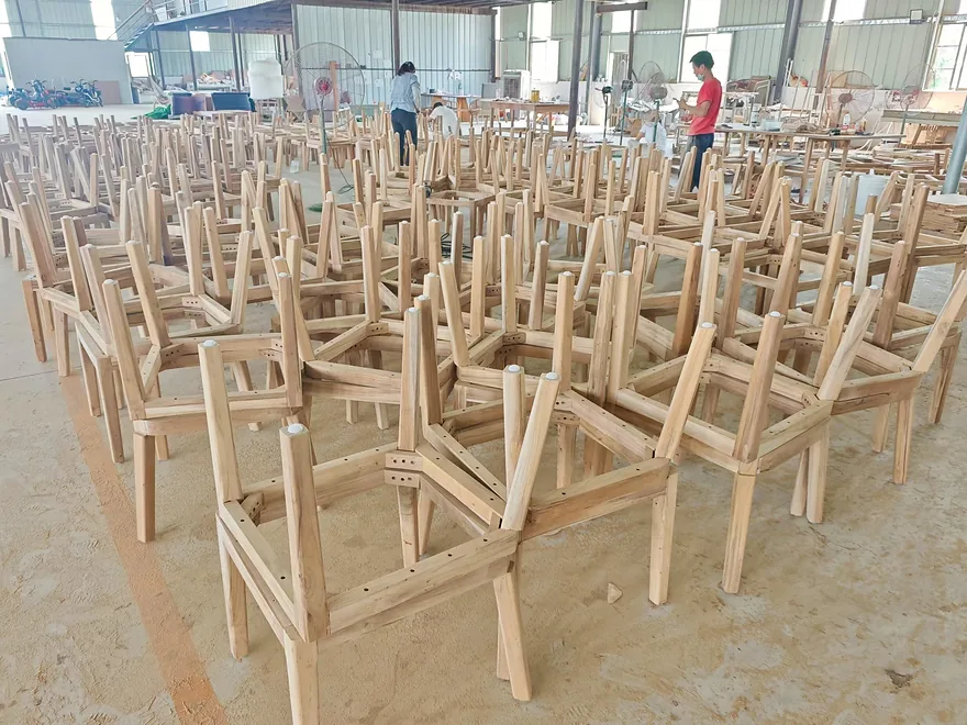 Solid teak chair frames on the KORDIA assembly floor